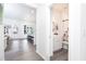 Bright hallway view to bathroom featuring a stylish vanity and floral shower curtain at 2106 Remy Ct, Kennesaw, GA 30144