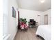 Bright bedroom featuring a bed, modern decor, and a comfortable chair and desk work area at 2106 Remy Ct, Kennesaw, GA 30144