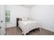 Serene bedroom features a comfortable bed, window with natural light, and hardwood flooring at 2106 Remy Ct, Kennesaw, GA 30144