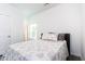 Comfortable bedroom featuring light-filled room with a cozy bed and beach-themed accents at 2106 Remy Ct, Kennesaw, GA 30144