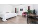 Inviting bedroom featuring a bed, modern decor, and a comfortable chair and desk work area at 2106 Remy Ct, Kennesaw, GA 30144