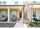 Inviting front porch featuring comfortable seating and stone accents, perfect for relaxing and enjoying the outdoors at 2106 Remy Ct, Kennesaw, GA 30144