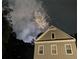 A rear view of a house during a fireworks display at 2106 Remy Ct, Kennesaw, GA 30144