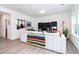 Bright living room boasts hardwood floors and stylish decor with guitars and comfortable seating at 2106 Remy Ct, Kennesaw, GA 30144