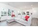 Spacious living room with ample natural light, modern furniture, and open access to the kitchen at 2106 Remy Ct, Kennesaw, GA 30144