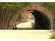 Pathway through a stone archway, creating a unique and inviting entrance to the community at 2106 Remy Ct, Kennesaw, GA 30144