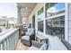 Comfortable porch seating with bright, sunny views at 2106 Remy Ct, Kennesaw, GA 30144