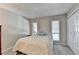 Neutral bedroom featuring carpeted floors, light walls, and double windows for ample natural light at 5149 Roswell Rd # 7, Atlanta, GA 30342