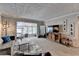 Open living room with modern furnishings, plush carpet, and large entertainment center at 5149 Roswell Rd # 7, Atlanta, GA 30342