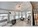 Sun-drenched sun room with large windows and views of the pool at 5149 Roswell Rd # 7, Atlanta, GA 30342