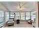 Inviting sun room with tiled floor and window views to the outdoors at 5149 Roswell Rd # 7, Atlanta, GA 30342
