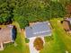 Stunning aerial view of the house showcasing its well-maintained lawn, mature trees, and neighborhood at 5425 Windswept Trce, Sugar Hill, GA 30518