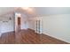 Bright attic space with hardwood floors, built-in shelving, and ample storage at 5425 Windswept Trce, Sugar Hill, GA 30518
