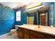 Bathroom with blue wall and vanity at 5425 Windswept Trce, Sugar Hill, GA 30518