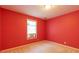 Bedroom with red walls and a large window with an air conditioner at 5425 Windswept Trce, Sugar Hill, GA 30518