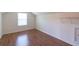 Bonus room features wood flooring and shelving at 5425 Windswept Trce, Sugar Hill, GA 30518