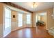 Bright dining room featuring wood floors, a bay window and a glass door, letting in natural light at 5425 Windswept Trce, Sugar Hill, GA 30518