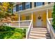 Welcoming front porch with white railings and stairs, perfect for relaxing at 5425 Windswept Trce, Sugar Hill, GA 30518