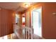 Upstairs hallway with multiple doorways and stairs leading downstairs at 5425 Windswept Trce, Sugar Hill, GA 30518