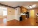 Kitchen featuring wood cabinets, appliances and hardwood floors, all in a vintage style at 5425 Windswept Trce, Sugar Hill, GA 30518