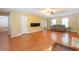 Comfortable living room featuring hardwood floors and a cozy atmosphere at 5425 Windswept Trce, Sugar Hill, GA 30518