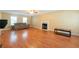 Bright living room with hardwood floors and fireplace, perfect for gatherings at 5425 Windswept Trce, Sugar Hill, GA 30518