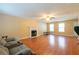 Inviting living room with fireplace and hardwood floors at 5425 Windswept Trce, Sugar Hill, GA 30518