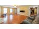 Open living room with hardwood floors, ideal for entertaining guests at 5425 Windswept Trce, Sugar Hill, GA 30518