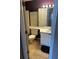 A neutral colored bathroom with beige tiled flooring and traditional vanity at 621 Ridge Creek Dr, Clarkston, GA 30021