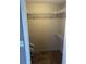 Walk-in closet with overhead wire shelving for storage of clothing and accessories at 621 Ridge Creek Dr, Clarkston, GA 30021