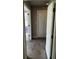 Hallway view with double doors, a closet, and purple accent wall paint at 621 Ridge Creek Dr, Clarkston, GA 30021