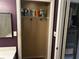 A storage space in a home, with shelves and a peek at the furnace at 621 Ridge Creek Dr, Clarkston, GA 30021