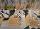 Aerial view of home with well-maintained lawn, landscaping, driveway, and neighborhood at 1070 Cureton Dr, Austell, GA 30106