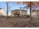 Spacious backyard featuring patio area, landscaping, stepping stone walkway, and mature trees at 1070 Cureton Dr, Austell, GA 30106