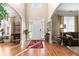 Inviting foyer with hardwood floors, soaring ceilings, and a view of the staircase and living areas at 1070 Cureton Dr, Austell, GA 30106