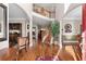 Grand foyer featuring hardwood floors, high ceilings, an open staircase, and elegant architectural details at 1070 Cureton Dr, Austell, GA 30106