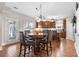 Eat-in kitchen boasts rich wood cabinets, breakfast table, stainless appliances, and views to the backyard at 1070 Cureton Dr, Austell, GA 30106
