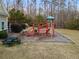 Community playground featuring play equipment and picnic tables at 1070 Cureton Dr, Austell, GA 30106