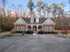 Pool house with brick facade and covered entry surrounded by parking at 1070 Cureton Dr, Austell, GA 30106