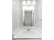 Bathroom with quartz countertops, mirror, and modern faucet at 11827 Spring Lake Way, Fayetteville, GA 30215