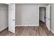Bright bedroom features neutral walls, hardwood flooring and a white door to the closet at 11827 Spring Lake Way, Fayetteville, GA 30215