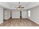 Expansive bedroom features a trey ceiling with fan, lots of light, and hard surface floors at 11827 Spring Lake Way, Fayetteville, GA 30215