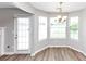 Cozy dining area with a bay window and access to the backyard at 11827 Spring Lake Way, Fayetteville, GA 30215