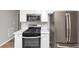 Modern kitchen with stainless steel appliances, quartz countertops and ample cabinet space at 11827 Spring Lake Way, Fayetteville, GA 30215