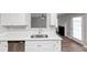 Kitchen with quartz countertops, stainless steel dishwasher, and backyard access at 11827 Spring Lake Way, Fayetteville, GA 30215