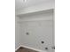 Unfinished laundry room ready for washer/dryer hookups, shelving included at 11827 Spring Lake Way, Fayetteville, GA 30215