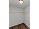 Walk-in closet with wood floor, wire shelving, and painted walls at 11827 Spring Lake Way, Fayetteville, GA 30215