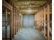 Spacious unfinished basement with exposed framing and concrete walls at 1320 Kildare Ct, Snellville, GA 30078