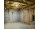 Unfinished basement with exposed framing and concrete walls at 1320 Kildare Ct, Snellville, GA 30078