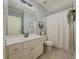 Bathroom with a neutral color scheme, white vanity, and decorative shower curtain at 1320 Kildare Ct, Snellville, GA 30078